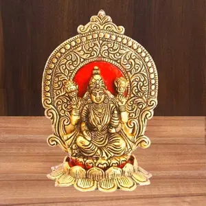 Lakshmi showpiece in Metal with Beautiful Carving Around it Seated on Lotus