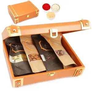 Ghasitaram Gifts Bhaidhooj Gifts- Orange Trunk Box of Almonds, Mewa Bites, Banarsi Paan and Chocolate Coated Almondss