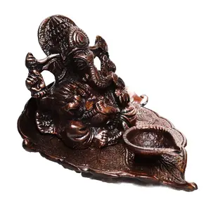 JAIPUR STONE WORK Lord Ganesha with Diya on Leaf Metal Figurine (10 cm x 13 cm x 8 cm Brown)
