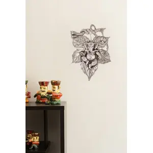 JAIPUR STONE WORK Lord Ganesha on Creative Leaf Metal Wall Hanging (20 cm x 1 cm x 29 cm Silver)